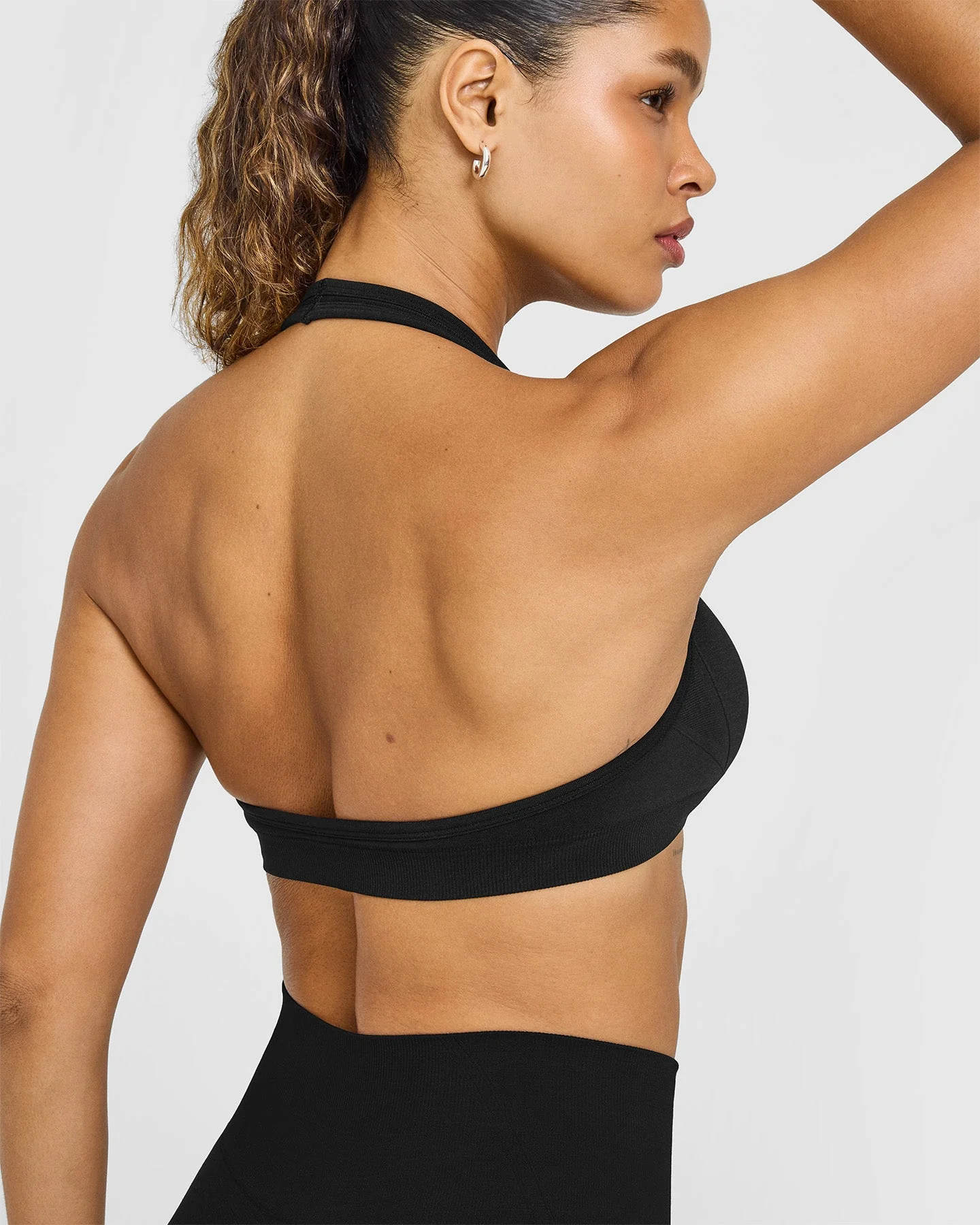 EffortlessLift™ Seamless Halter Neck Sports Bra with White Logo | Black - Image 4