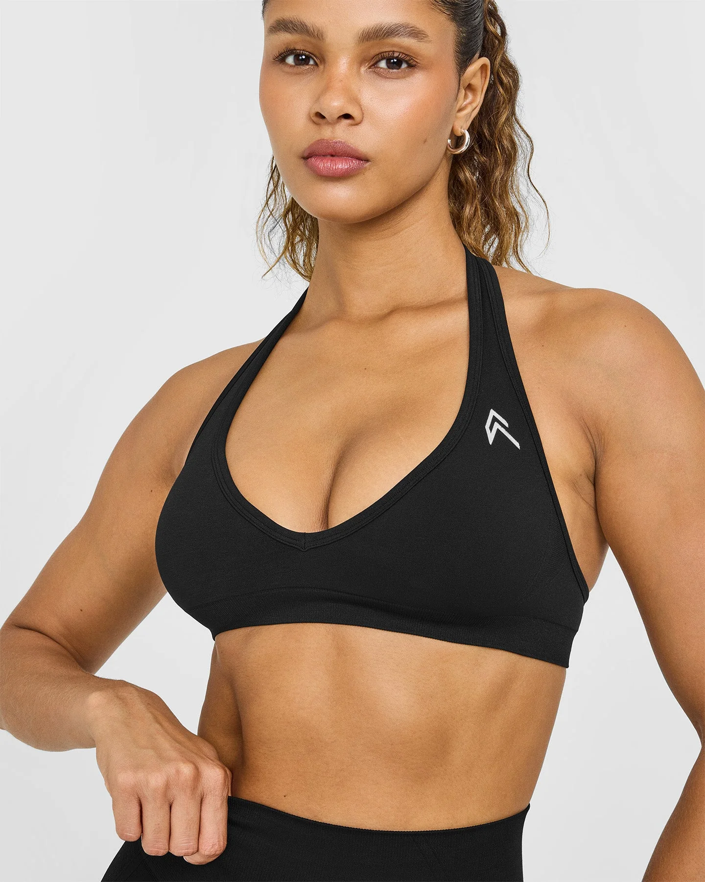 EffortlessLift™ Seamless Halter Neck Sports Bra with White Logo | Black - Image 5
