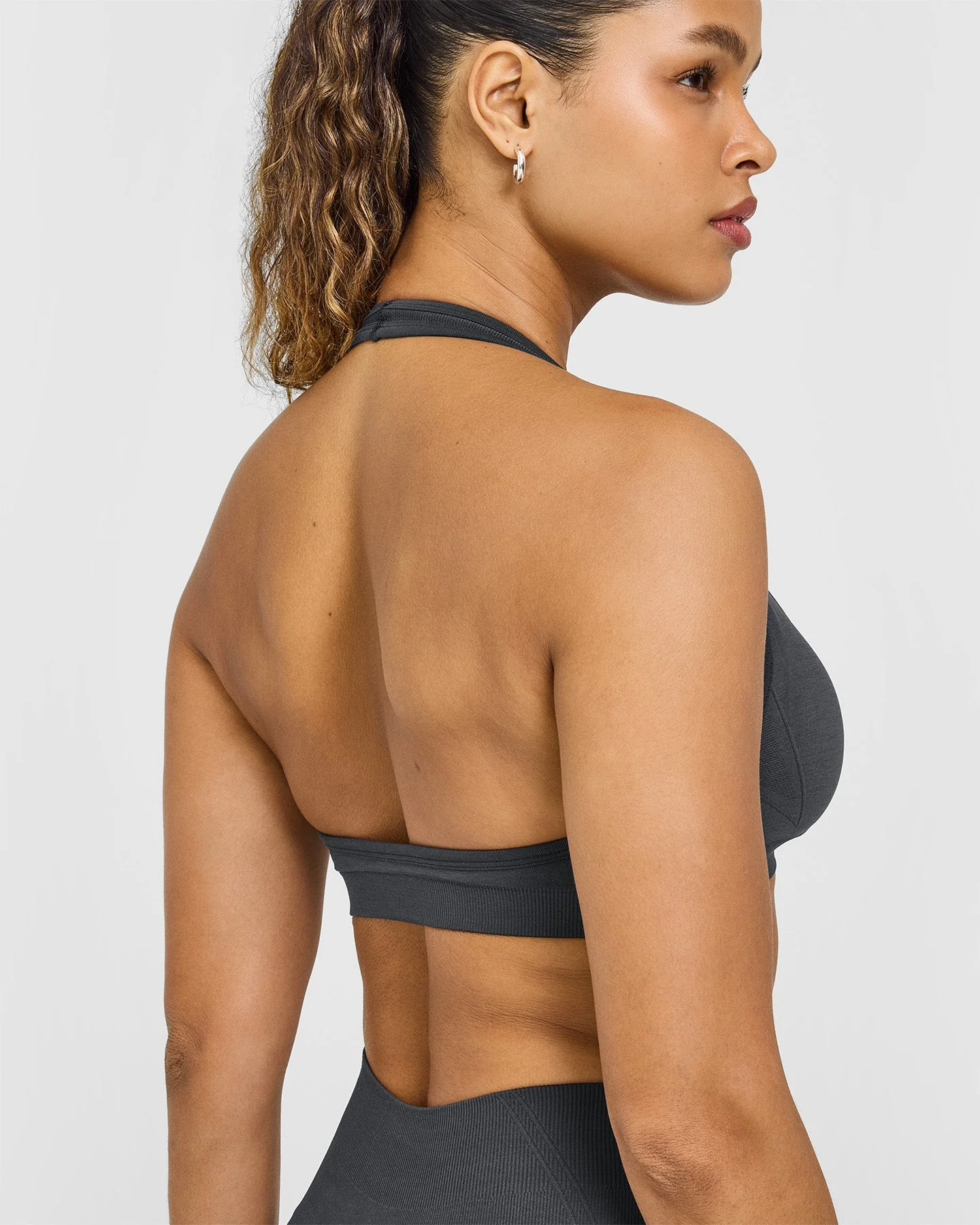 EffortlessLift™ Seamless Halter Neck Sports Bra with White Logo | Coal - Image 6