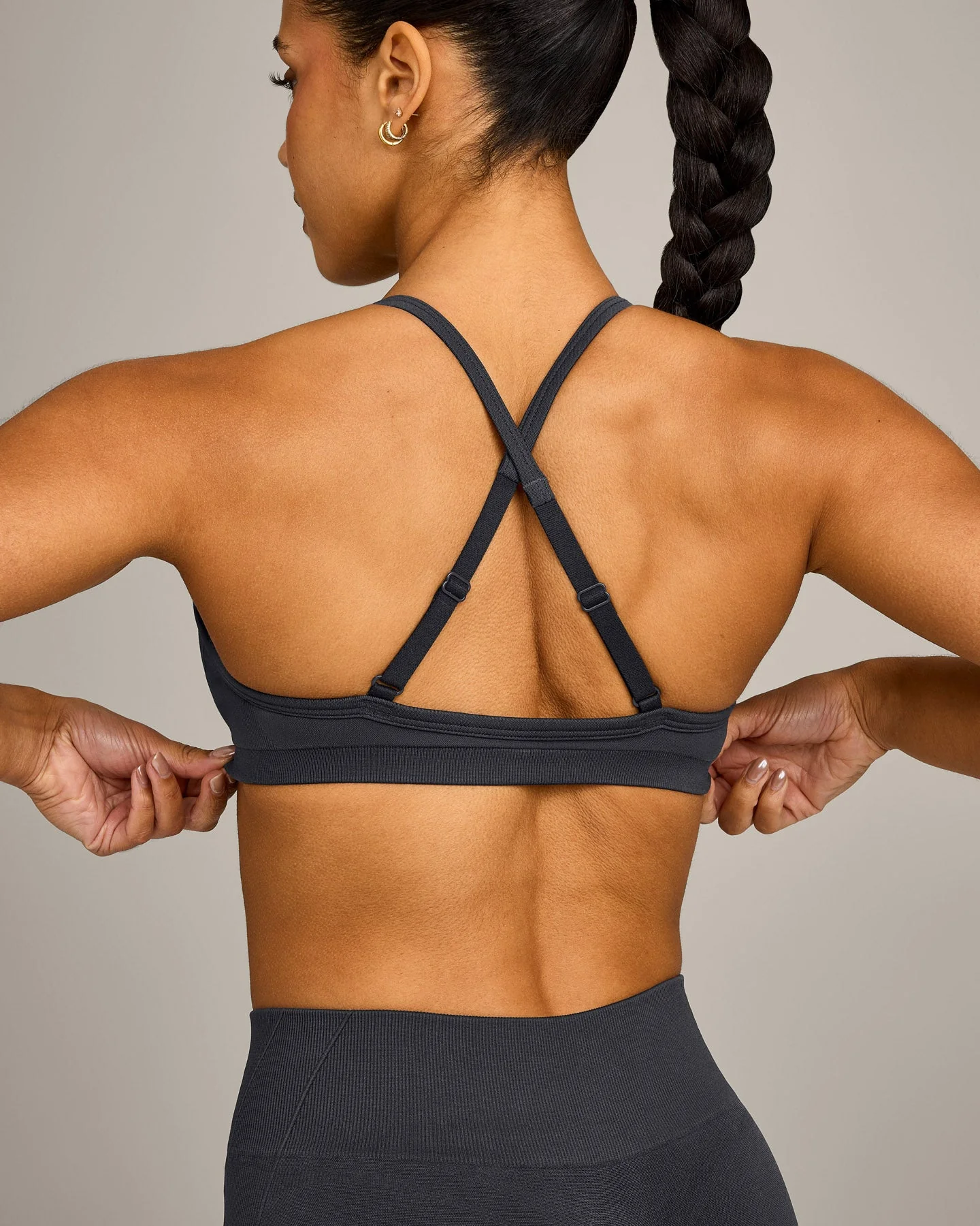 EnhanceLift™ Seamless Strappy Sports Bra with Grey Logo | Coal - Image 4