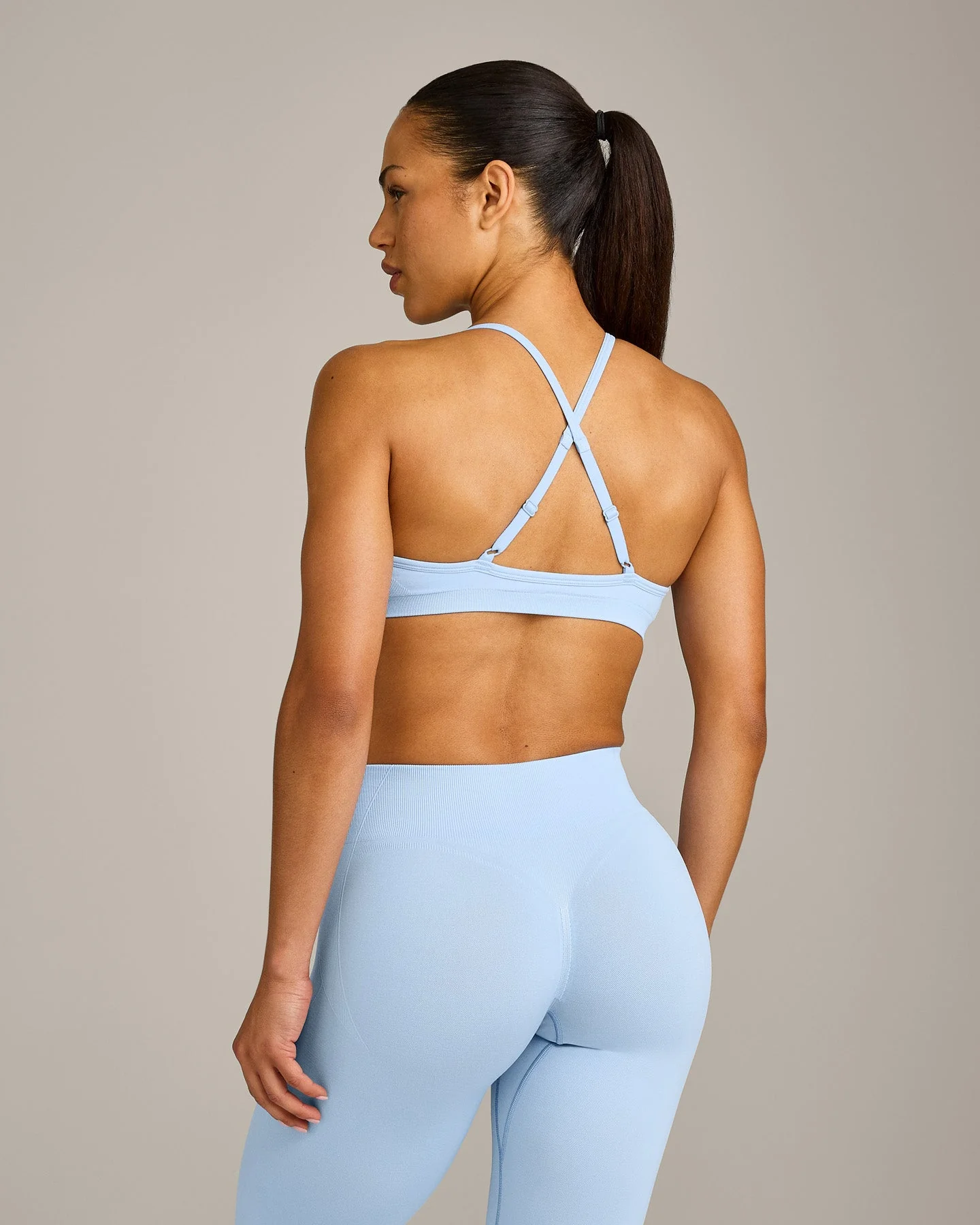 EnhanceLift™ Seamless Strappy Sports Bra with Grey Logo | Powdered Blue - Image 2