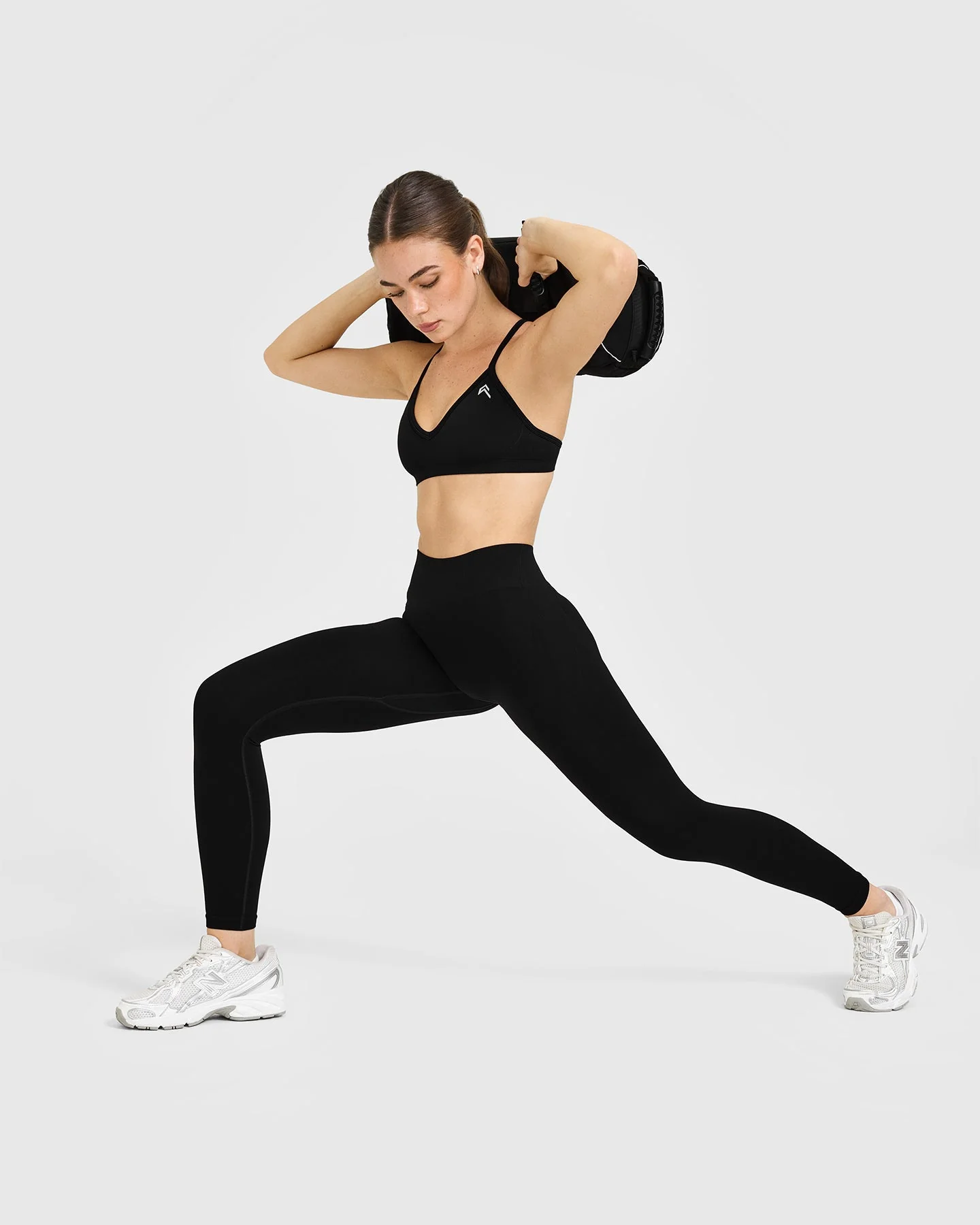EnhanceLift™ Seamless Strappy Sports Bra with White Logo | Black - Image 6