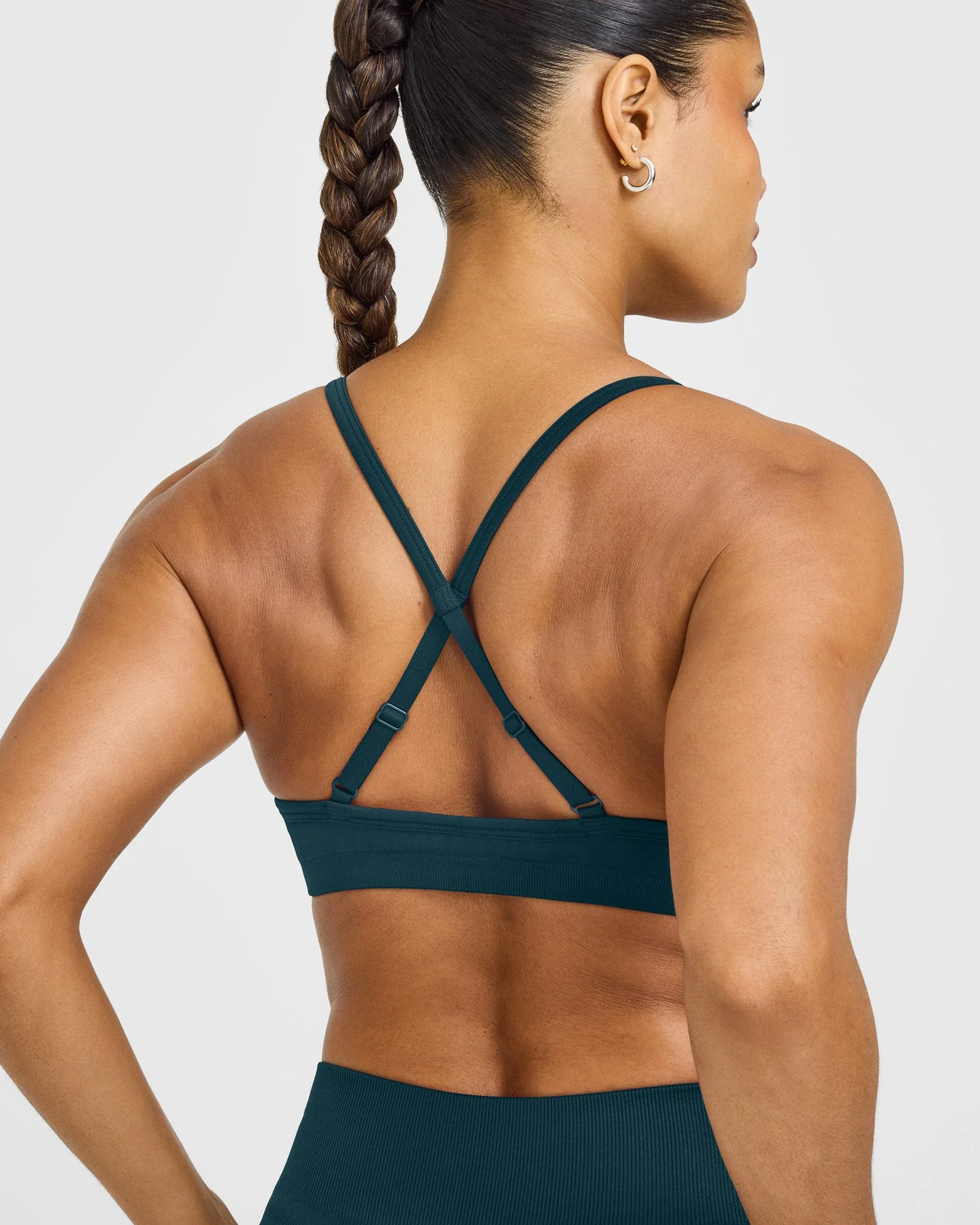 EnhanceLift™ Seamless Strappy Sports Bra with White Logo | Washed Oil Blue - Image 6