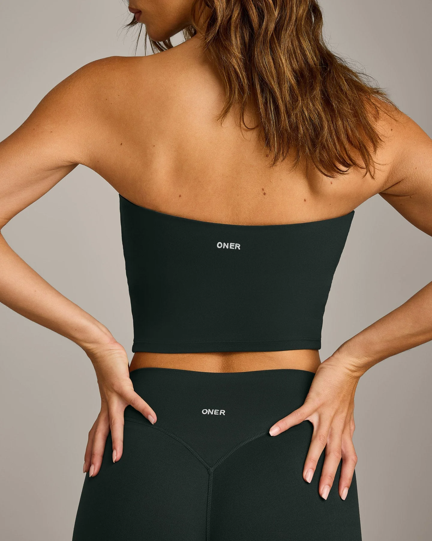 SoftMotion™ Bandeau Mid Vest with Built in Bra Shelf with Grey Logo | Emerald Noir - Image 2