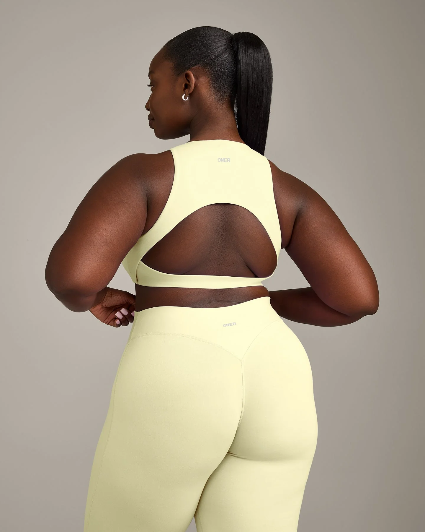 SoftMotion™ High Neck Sports Bra with Grey Logo | Pastel Yellow - Image 6