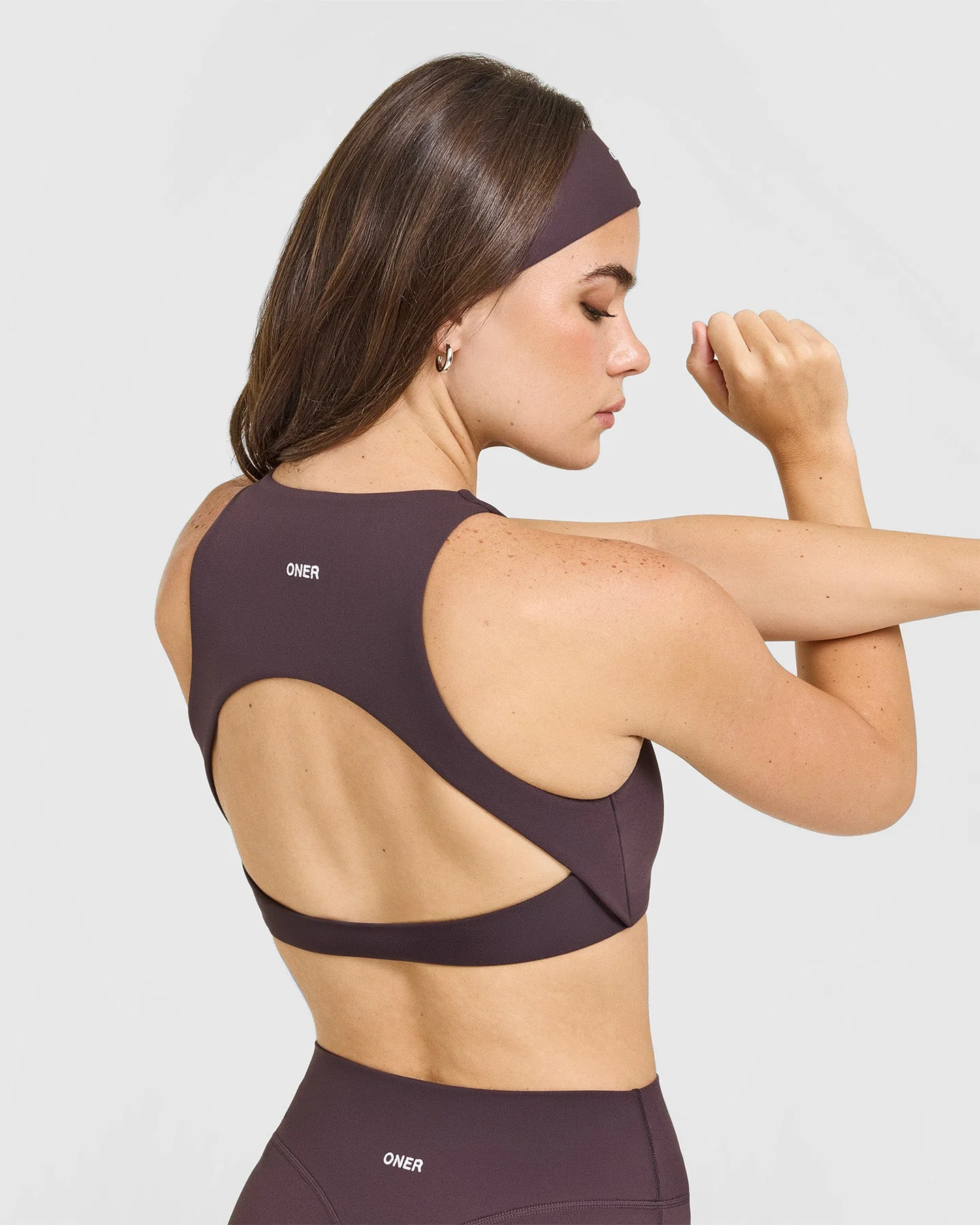 SoftMotion™ High Neck Sports Bra with White Logo | Dark Umber Brown - Image 4
