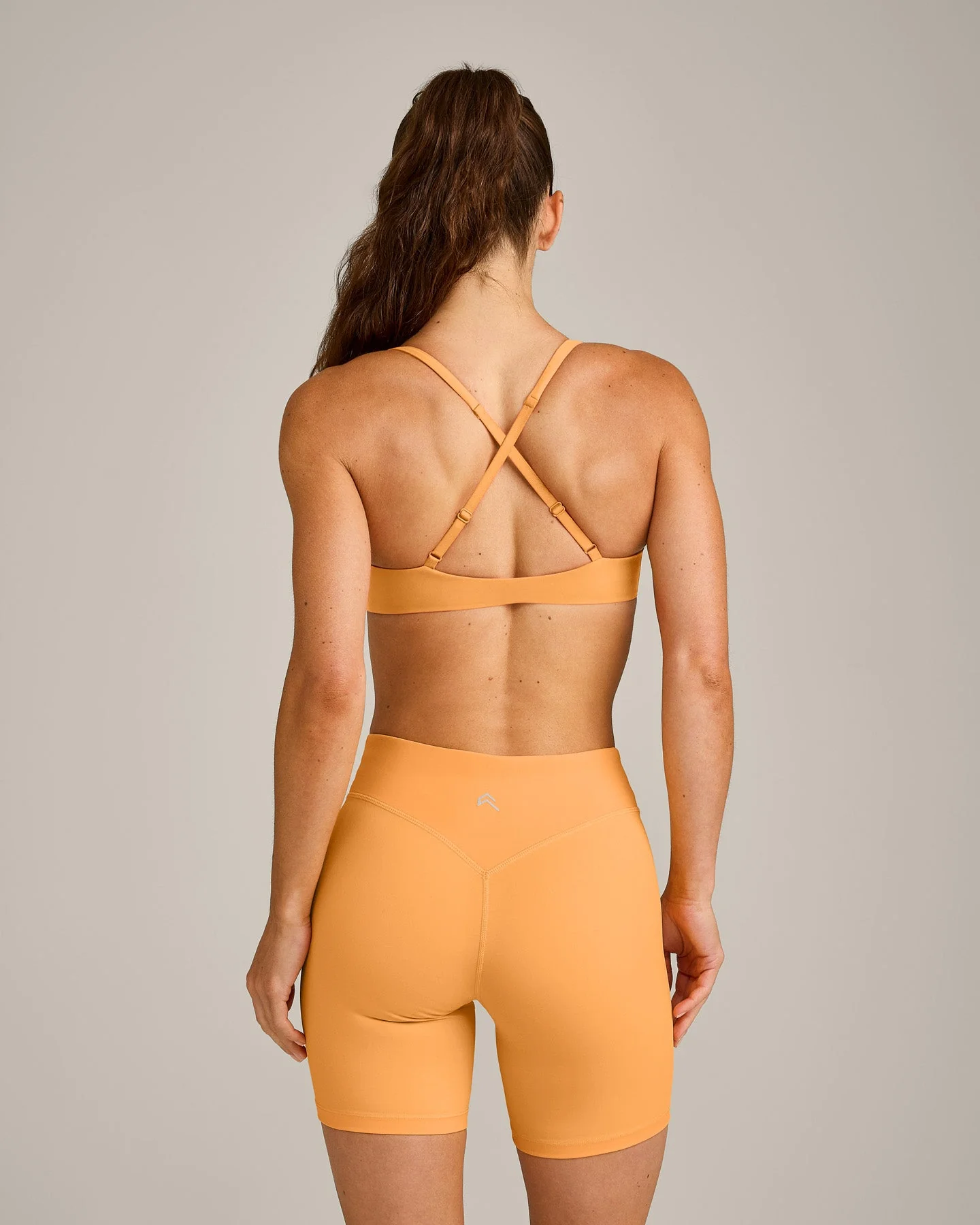 UnifiedMove™ Cross Back Sports Bra with Reflective Logo | Powdered Orange - Image 2