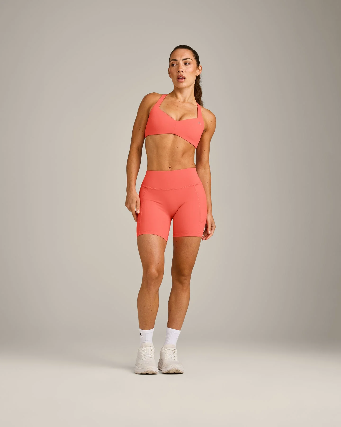 UnifiedMove™ T Back Minimal Bralette with Reflective Logo | Light Charged Coral - Image 3